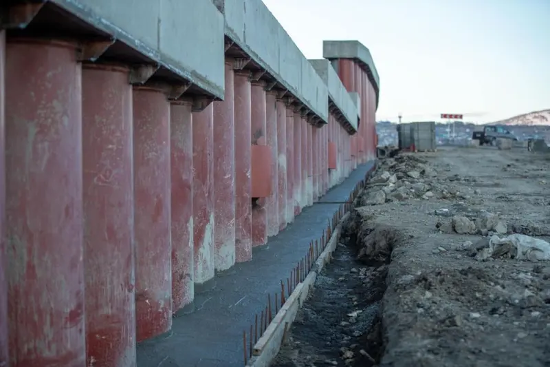 Concrete structure under construction supported by material props